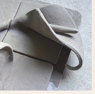Close-up of the Calla Lily tile set in the bone dry stage.